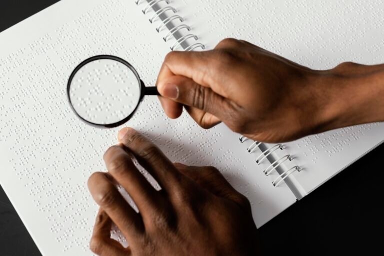 close up hand with magnifying glass 1 768x513